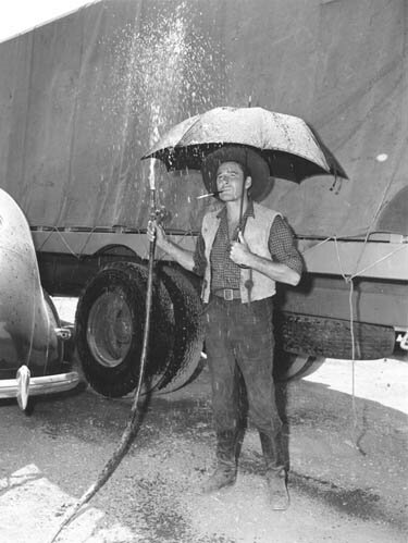 Errol Flynn goofing off during a break from shooting - 37kb