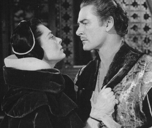 Errol Flynn with Viveca Linfors as the queen of Spain - 36kb