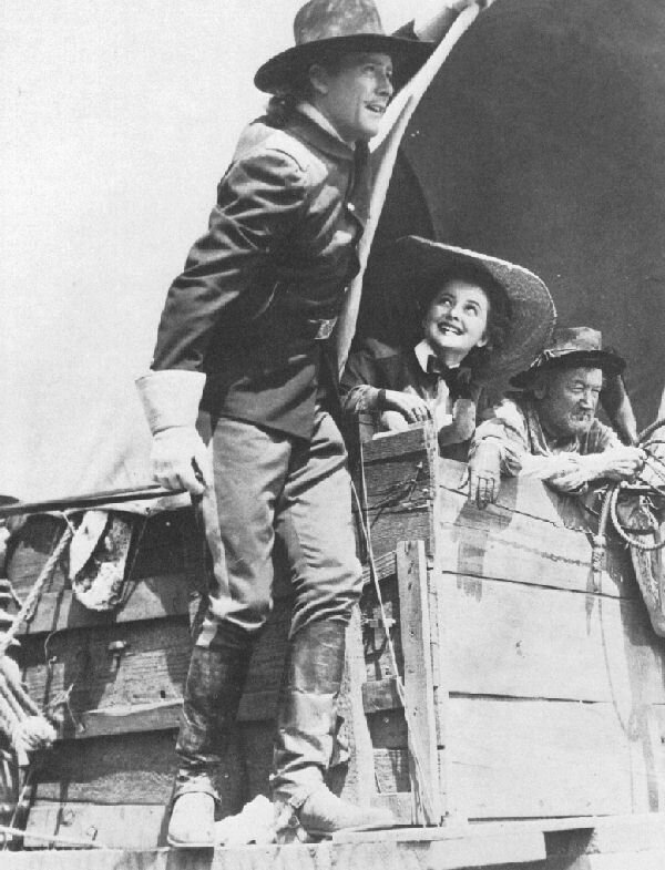Custer (Flynn) & 'Libby' (DeHavilland) with California Joe head for the Dakotas - 89kb