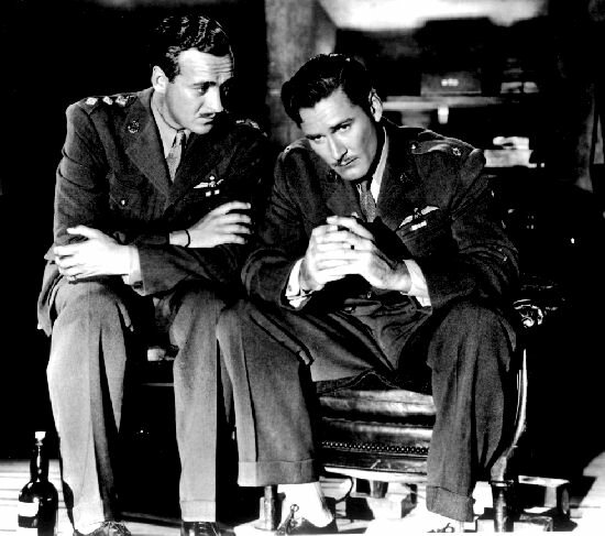 Errol Flynn & David Niven brood over the killing machine that is War - 55kb