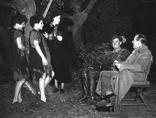 This production still shows that the Mauches switched off between roles; Flynn & director Keighley at right - 66kb